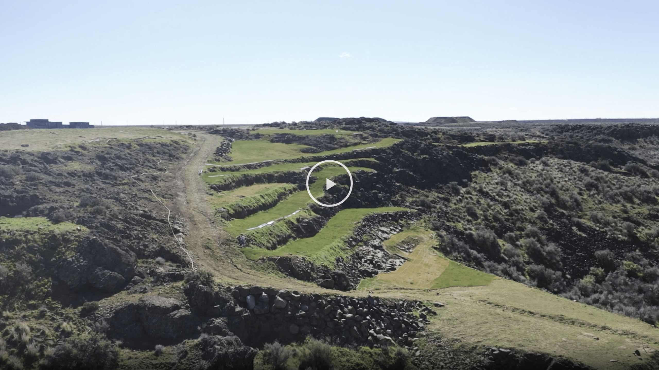 Aerial view of The Hilltop's grassy basalt terraces above the Columbia River Gorge near Quincy, Washington